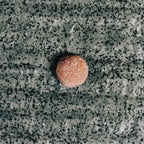 ELK Gummy on a textured gray surface
