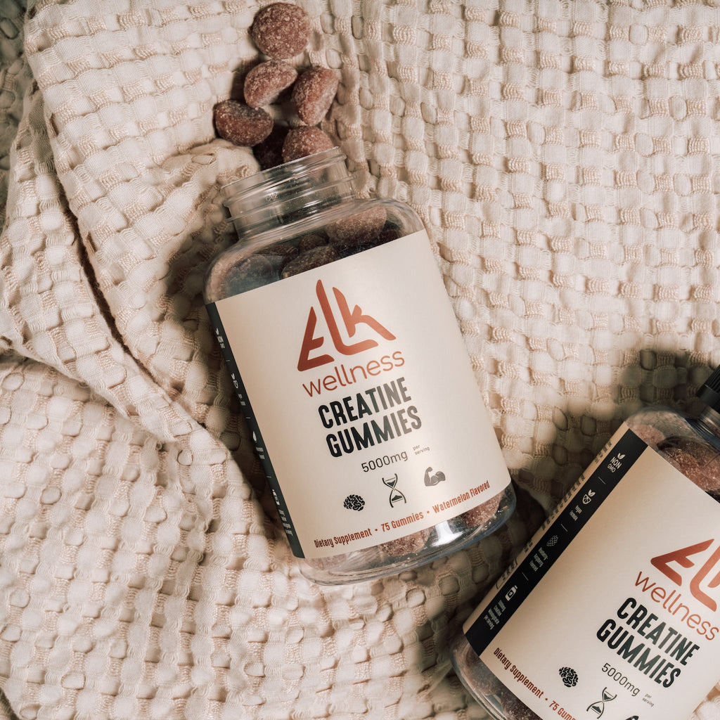 Bottle of ELK Wellness Creatine Gummies on a textured surface
